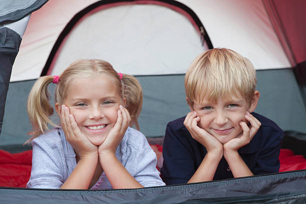 istock Brother And Sister Lying Inside Tent 475351775