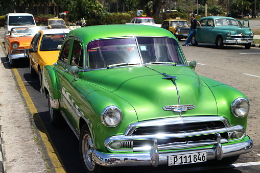 Havana, Сuba - April 7, 2015: Classic American cars parked at the Jose Marti Memorial in Havana, Cuba. Oldsmobile cars are often used as a tourist taxis in Cuba.