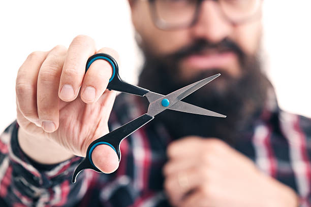 istock Close Up of Scissors Being Held By Hipster 475352898