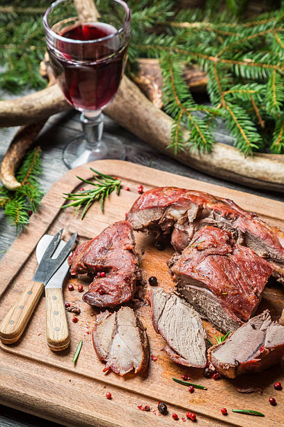 istock Sharing freshly roasted venison on a chopping board 475355091