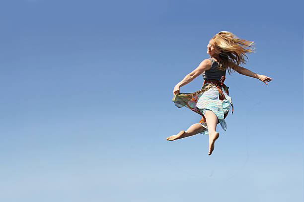 istock Dancing Woman Leaping through the Air 475356144