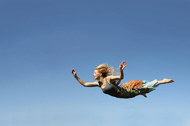 Woman Falling Through the Sky stock photo