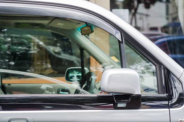 istock parked car in urban setting with window up 475357730