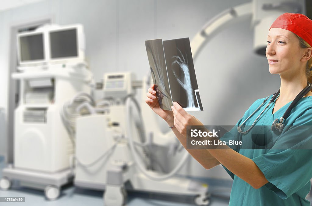 Doctor examining x-ray Doctor examining x-ray. Data Stock Photo