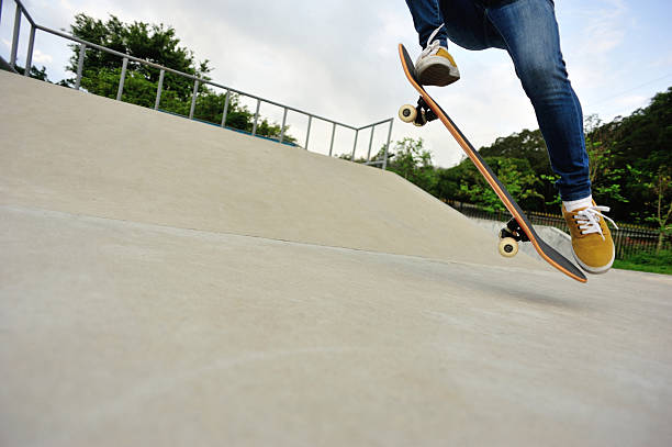 istock skateboarding legs sunrise skatepark 475362234