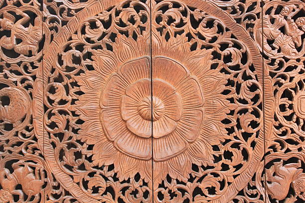 istock Pattern of flower carved on wood background 475364920