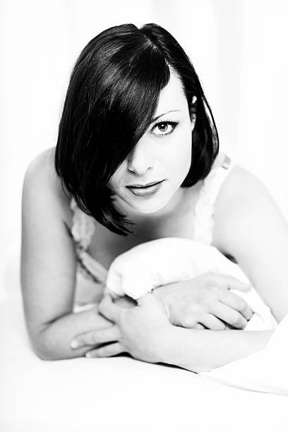 istock Beautiful woman laying in bed 475366644