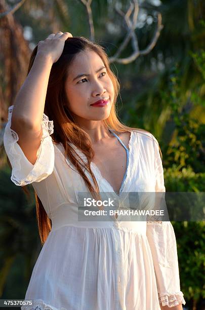 Woman On Her Morning Walk Stock Photo - Download Image Now - Adult, Asia, Beach