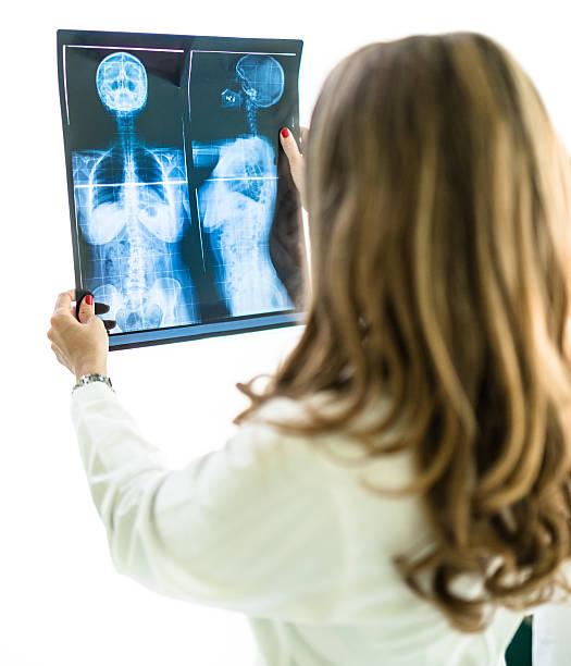 istock Pensive doctor looking the xray 475371002