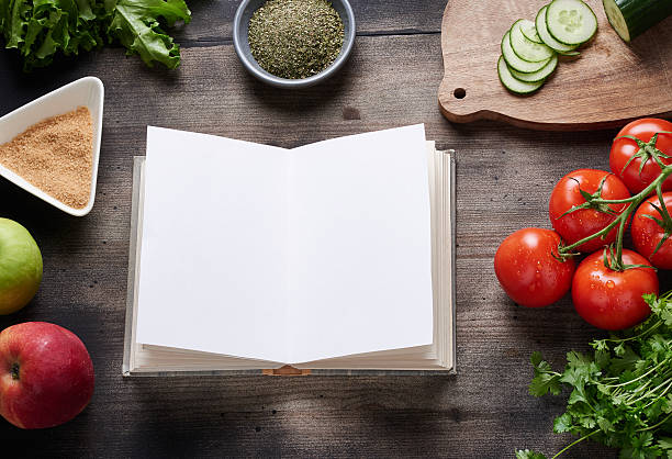 istock Cooking book on wooden table 475374074