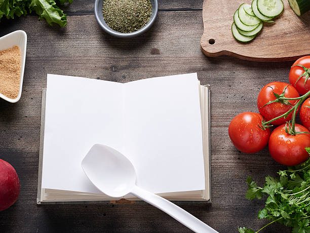 istock Cooking book on wooden table 475374076