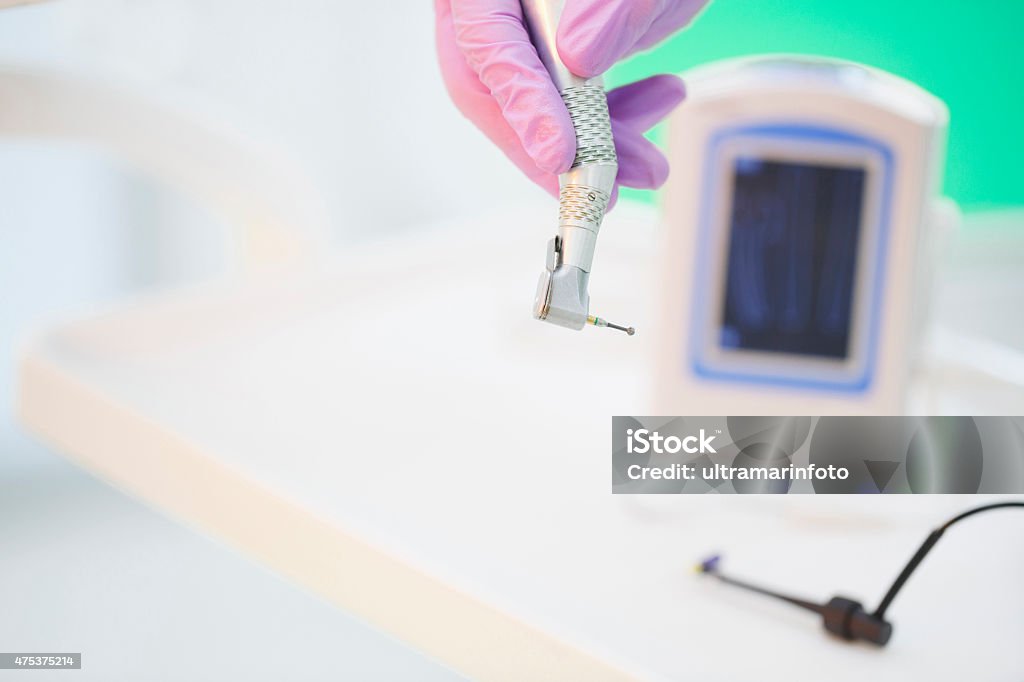 Dentistry   Dentist working dentist office   Modern Dental Drill   Close up Dentistry. Modern dental equipment. Dentist working, dentist office, Dental Drill. Close up. Selective focus. Very shallow depth of field for soft background. 2015 Stock Photo