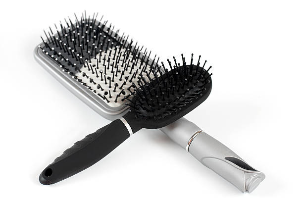 istock Two massage hairbrush on a light background 475376259