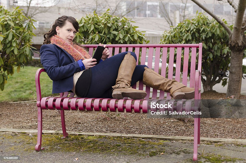 Woman with digital device Adult Stock Photo