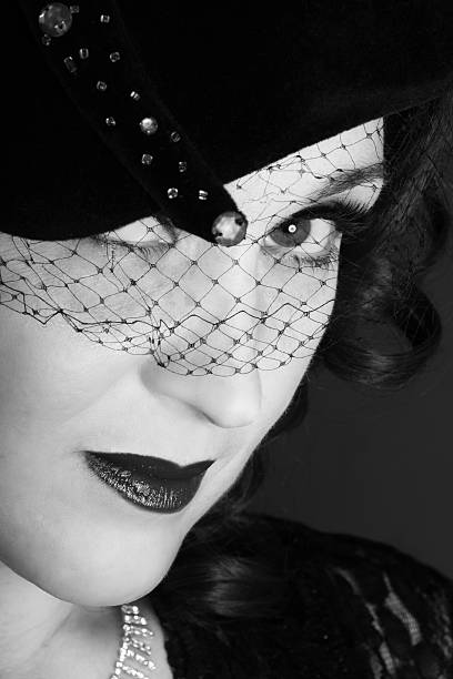 istock B&W semi-profile closeup with vintage hat. 475380715