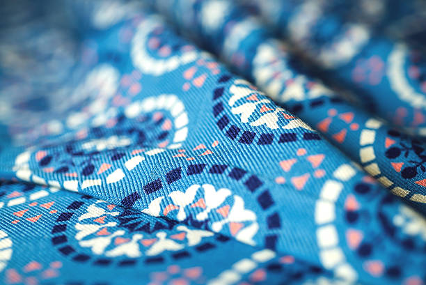 istock blue fabric textile with ornament on wooden background 475382042