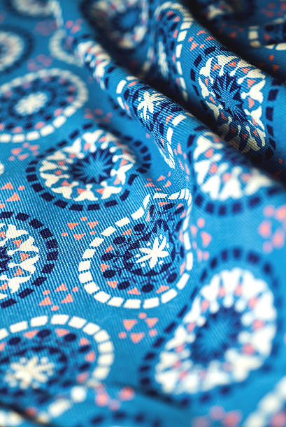 istock blue fabric textile with ornament on wooden background 475382196