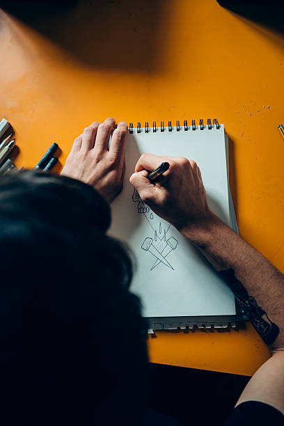 istock Tattoo Artist Drawing 475383472