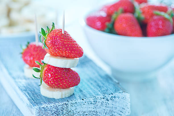 istock strawberry with banana 475383494