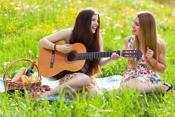 istock Two beautiful young women on a picnic 475383560