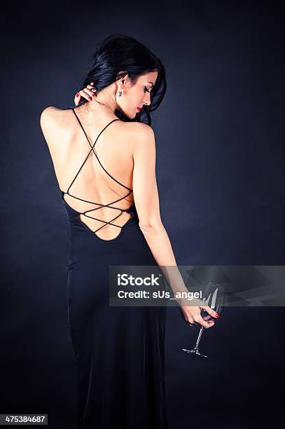 Woman In A Black Dress Stock Photo - Download Image Now - Dress, One Woman Only, Sensuality