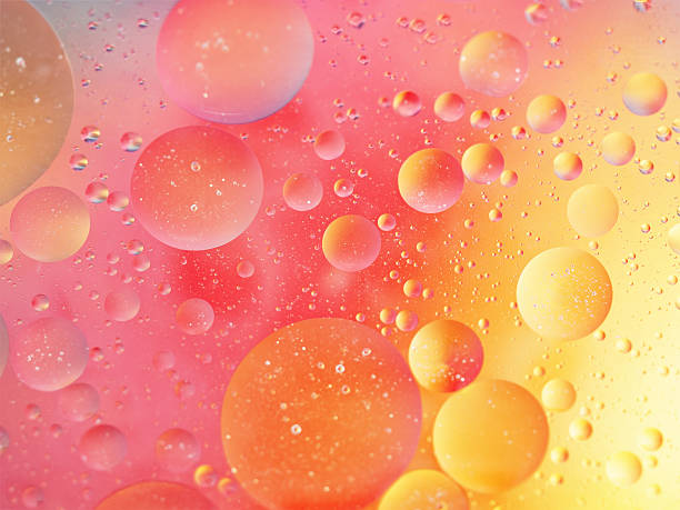 istock Pink and yellow bubbly background 475386318
