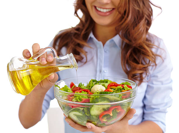 istock Dressing salad with olive oil 475388670