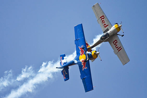 Bangalore, Karnataka, India – February 9, 2013: Flying Bulls Aerobatics Team performing synchronized flying formation with their Z-50LX aerobatic sports airplane built by the Czechoslovakian company Zlin Aircraft.