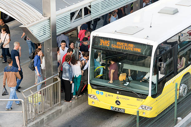 Istanbul, Turkey - May 26, 2015: People trying to get on to Metrobus, a divided bus lane for public transportation between Istanbul's crowded districts.