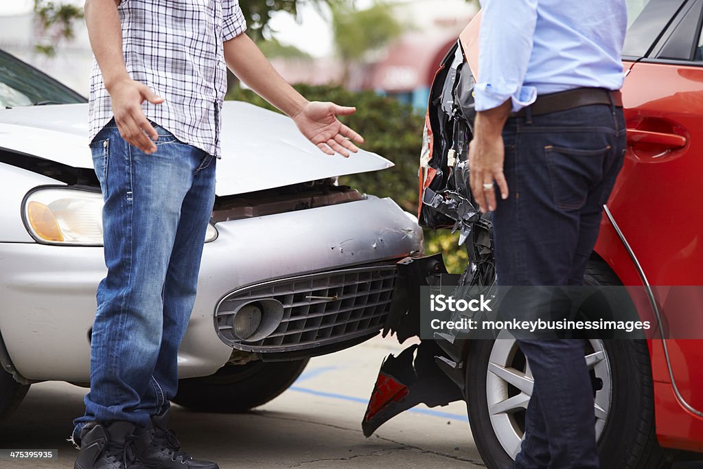 Two Drivers Arguing After Traffic Accident Two Drivers Arguing After Traffic Accident Crop Shot Of Crash. Car Accident Stock Photo