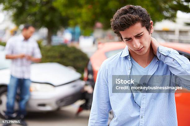 Teenage Driver Suffering Whiplash Injury Traffic Accident Stock Photo - Download Image Now