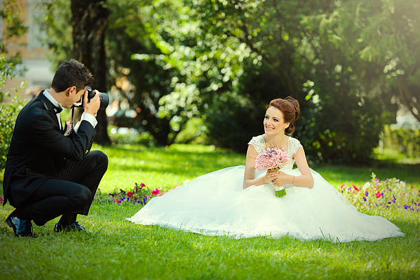 istock husband taking picture to his bride 475397915