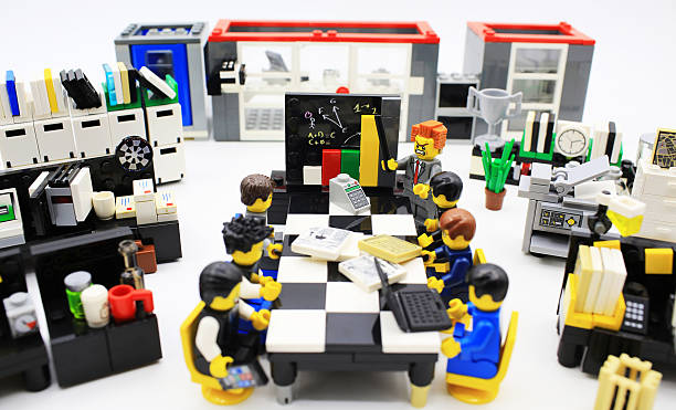 Hong Kong, Сhina - March 25, 2015:  Studio shot of Lego people in office, combine from different set. Legos are a popular line of plastic construction toys manufactured by The Lego Group in Denmark