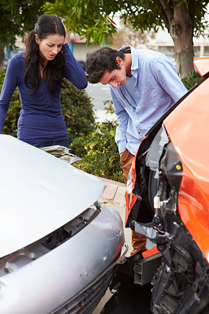 istock Two Drivers Inspecting Damage After Traffic Accident 475402095