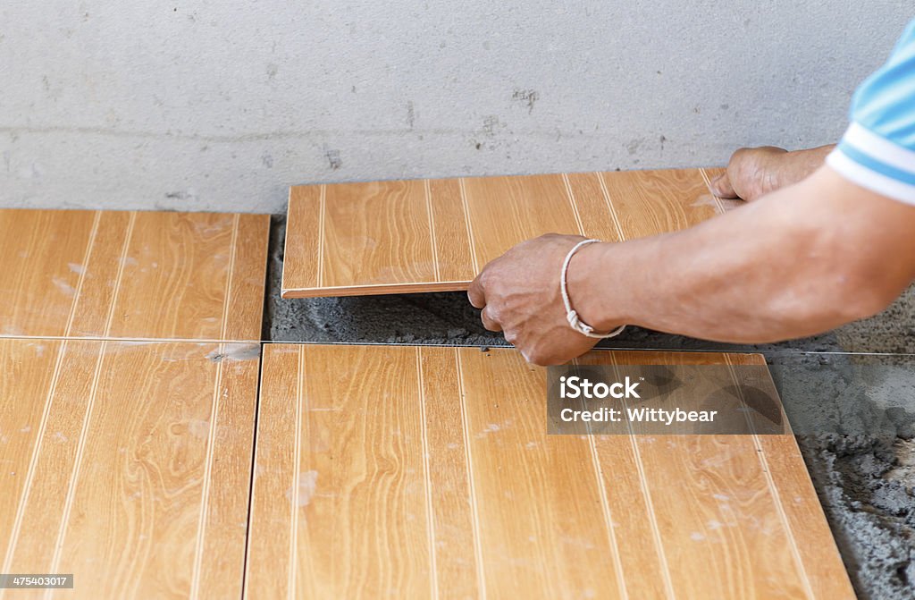 floor tile installation for house building Adult Stock Photo