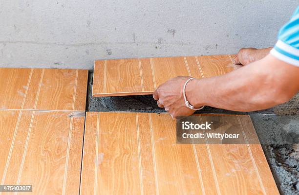 Floor Tile Installation For House Building Stock Photo - Download Image Now - Adult, Building Contractor, Cement