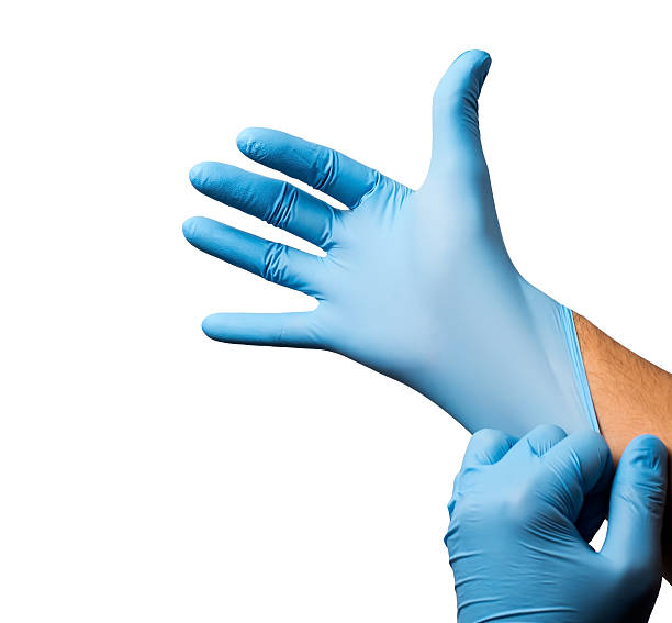 istock Doctor putting on protective gloves, isolated 475403170