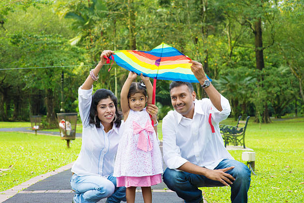istock Parents flying kite with child 475404441