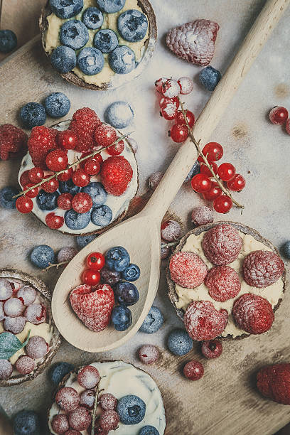 istock Berry tartlets in powdered sugar 475404801