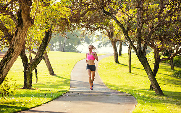 istock Woman running in the park 475405137