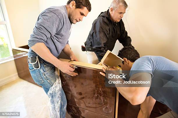 Assembling Custom Made Home Office Furniture Stock Photo - Download Image Now - Blue-collar Worker, Cabinet, Customized