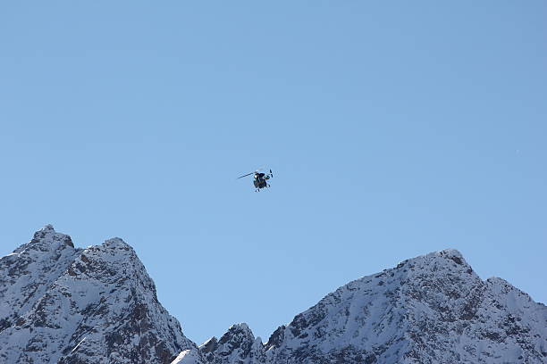 istock Blue helicopter in the clear sky 475426453