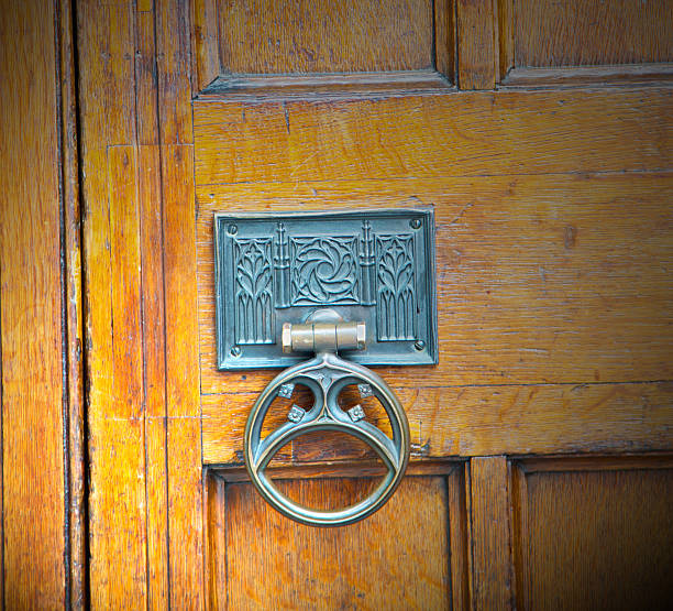 handle  in london antique brown door  rusty  brass nail and light