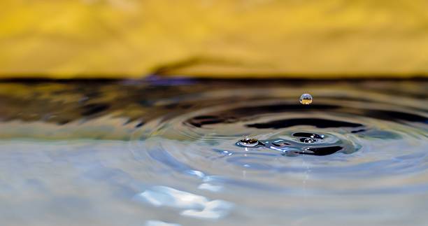 istock Water Droplet Landing In Water 475428388