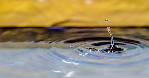istock Water Droplet Landing In Water 475428510