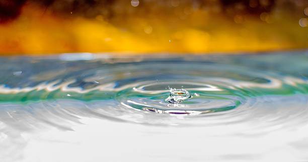 istock Water Droplet Landing In Water 475428664