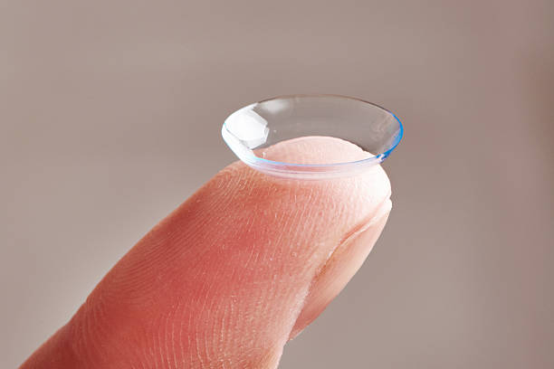istock Womans finger with contact lens 475428838