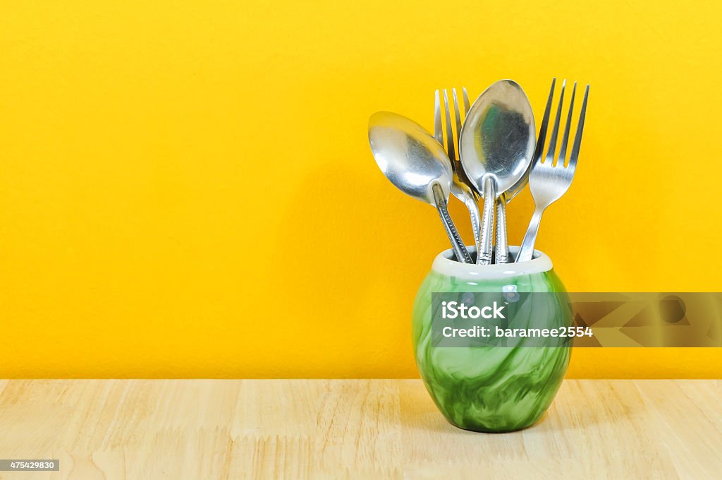 Beautiful retro kitchen enamelware: spoon and fork, vintage kitchen. Kitchenware Department Stock Photo