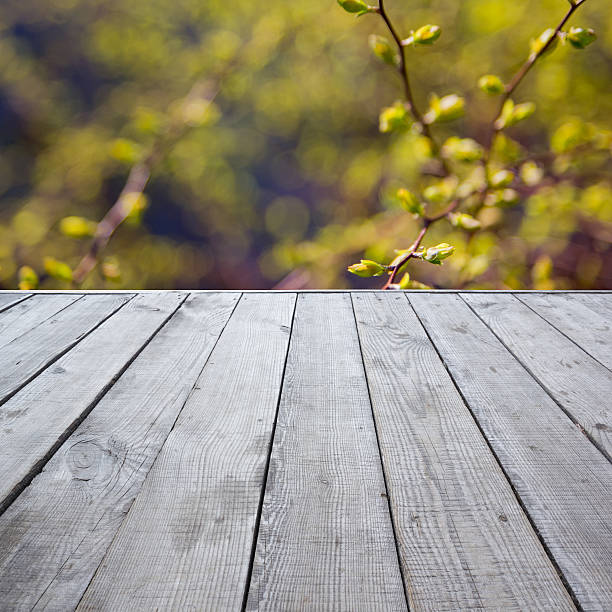 istock Wooden perspective floor with planks on blurred background 475429980