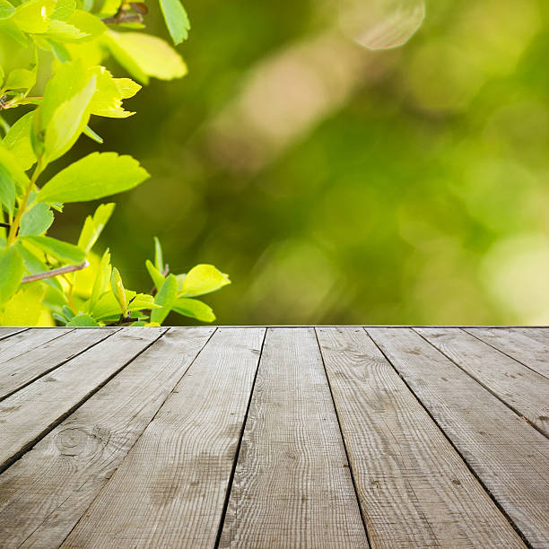 istock Wooden perspective floor with planks on blurred background 475429986